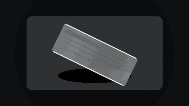 925 sterling silver 1 ounce bar spinning on dark concrete slab
